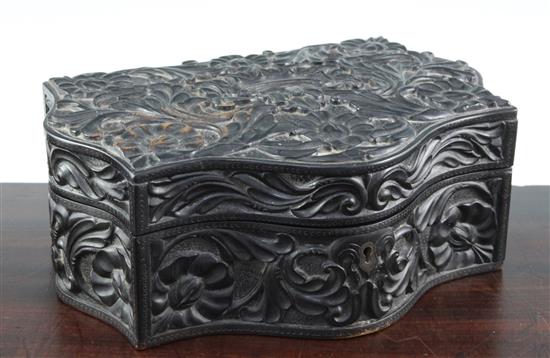 A 19th century serpentine shaped Ceylonese ebonised wood box, 10.75in.